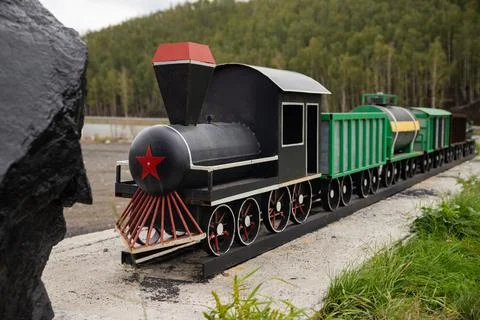 Old soviet toy train with red star on front. Replica of an engine model Stock Photos