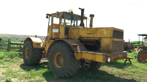 Old soviet tractor stand broken on the collective farm Stock Footage 119495710