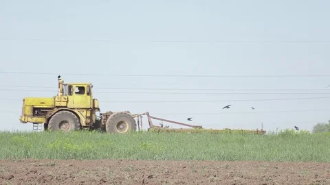 Old soviet tractor working in the field. 4k. Flat pikture profile 스톡 동영상 75818651