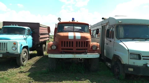 Old soviet trucks stand broken on the collective farm Stock Footage 119495605