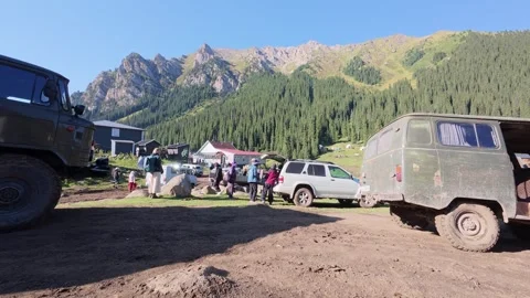 Old Soviet UAZ vans in a mountain village, Issyk-Kul Region, Kyrgyzstan Stockbeeldmateriaal 347242635