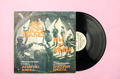 Old Soviet vinyl record from the 80's on a pink background. A collection of m Stock Photos