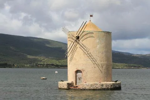 Old Spanish windmill in Orbetello lagoon near the Argentario peninsula, Tuscany Stock Photos