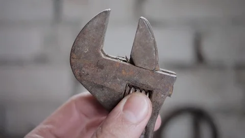 Old spanner and male hands in work close up. Stock Footage 74065822