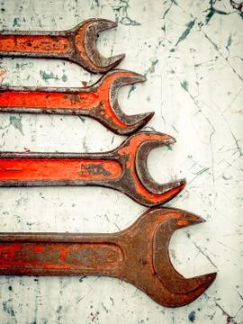 Old spanners. Grunge background of instruments. Keys close-up. Vintage turquo Stock Photos