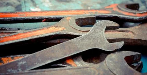 Old spanners. Grunge background of instruments. Keys close-up. Vintage turquo Stock Photos