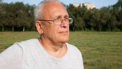 An Old Spectacled Happy Man Looking Far Away Calmly Stock Footage 114646528