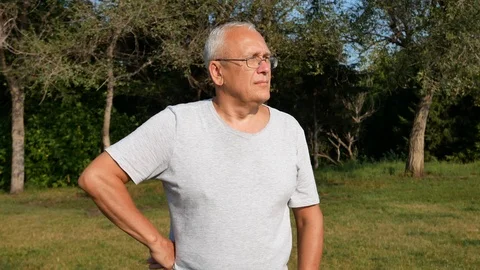 An Old Spectacled Man Looking Far Away Belligerently Stock Footage 114646841