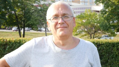 An Old Spectacled Man Staring at Camera and Smiling Stock Footage 114652305