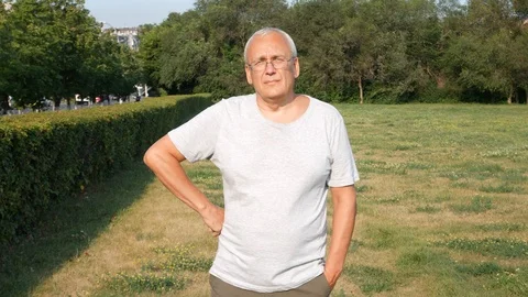 An Old Spectacled Man Staring at Camera Seriously Stock Footage 114652767