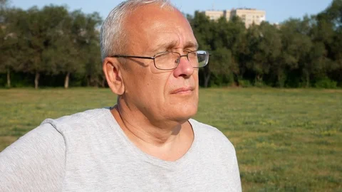 An Old Spectacled Sad Man Looking Far Away Anxiously Stock Footage 114652912