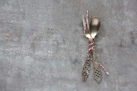Old spoon and fork on gray wooden background 스톡 사진