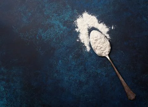 Old spoon with flour Stock Photos