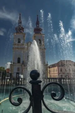 Old square with blue sky and fountain in sunny day in Kadan Stock Photos
