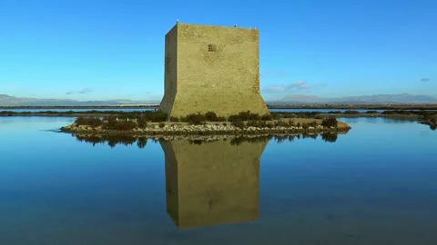 An old square tower in a salt lake near Santa Pola. Stock Footage 135351060