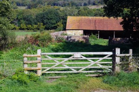 Old stables with a gate 库存照片