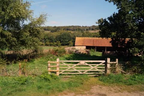 Old stables with a gate Stockfoto's