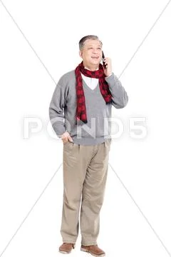 Old standing Asian man in grey jumper and scarf Stock Photos