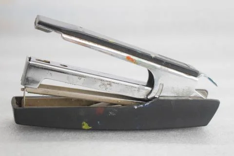 Old stapler machine stained by paint Stock Photos