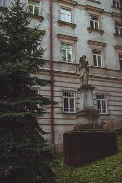 Old statue in front of The Higher Theological Seminary in Przemysl Stock Photos