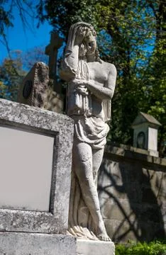 Old statue on grave Stock Photos