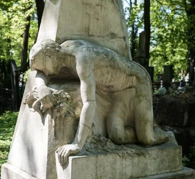 Old statue on grave 写真素材