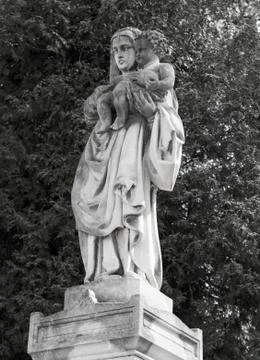 Old statue on grave Stock Photos