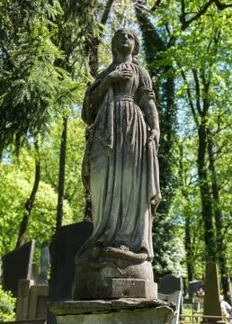 Old statue on grave 写真素材