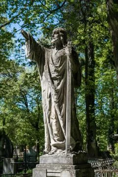 Old statue on grave 写真素材