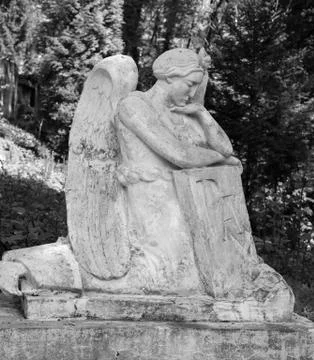 Old statue on grave 写真素材