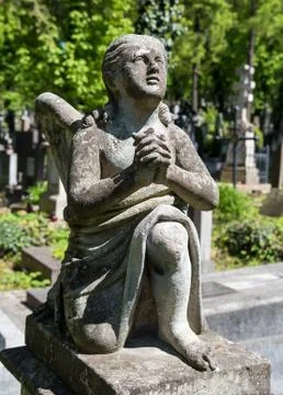 Old statue on grave Stock Photos