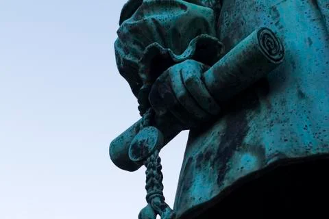 Old statue holding scroll Stock Photos