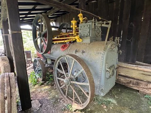 Old steam engine in rustic shed Stock Photos