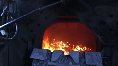 The old steam locomotive boiler fire burns Stock Footage 59665056