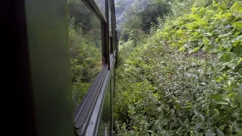Old steam train going through the mountains Stock Footage 113555673