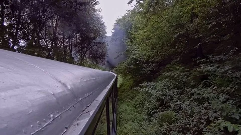 Old steam train going through the mountains Stock Footage 113555876