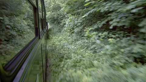 Old steam train going through the mountains Stock Footage 113557628