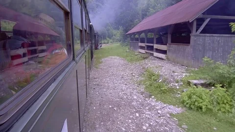 Old steam train going through the mountains Stock Footage 113557930