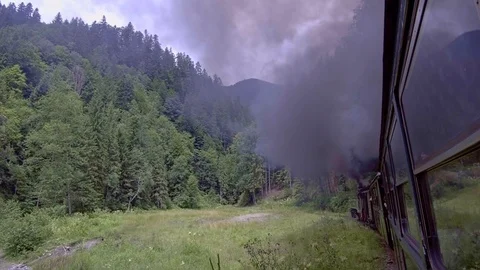Old steam train going through the mountains Stock-Footage 113559075