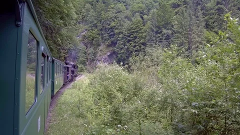 Old steam train going through the mountains Stock-Footage 113559913