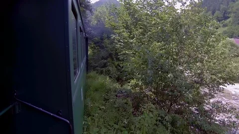 Old steam train going through the mountains Stock Footage 113562541