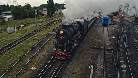Old steam train leaving the station. Drone video. Republic of Karelia Stock Footage 237747951