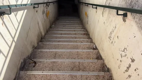 Old steps down into the ground staircase in a building leading down with a Stock Footage 293170039