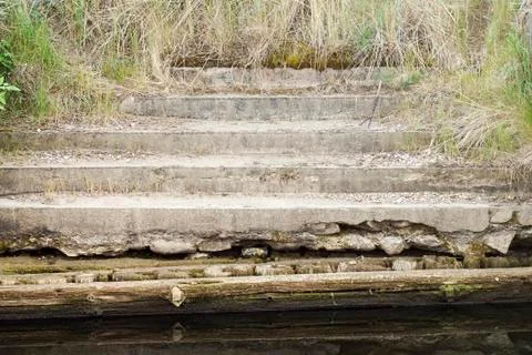 Old steps leading down into sea Foto stock