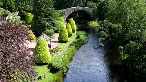 Old stone arch bridge over river Doon in Ayr, Scotland 動画素材 300709418