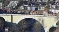 Old stone arch bridge Untertorbrucke spanning Aare river in Bern, Switzerland HD Footage