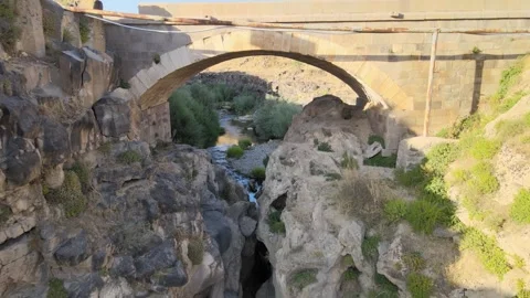 Old stone bride over river Stock Footage 240759894