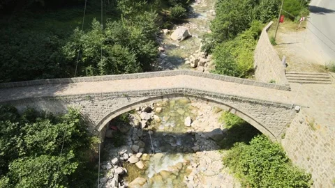 Old stone bride over river Stock Footage 240771439