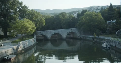 Old stone bridge with 3 arches wide shot 動画素材 141742437