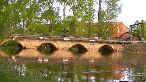 Old stone bridge across the river Stock Footage 75789424